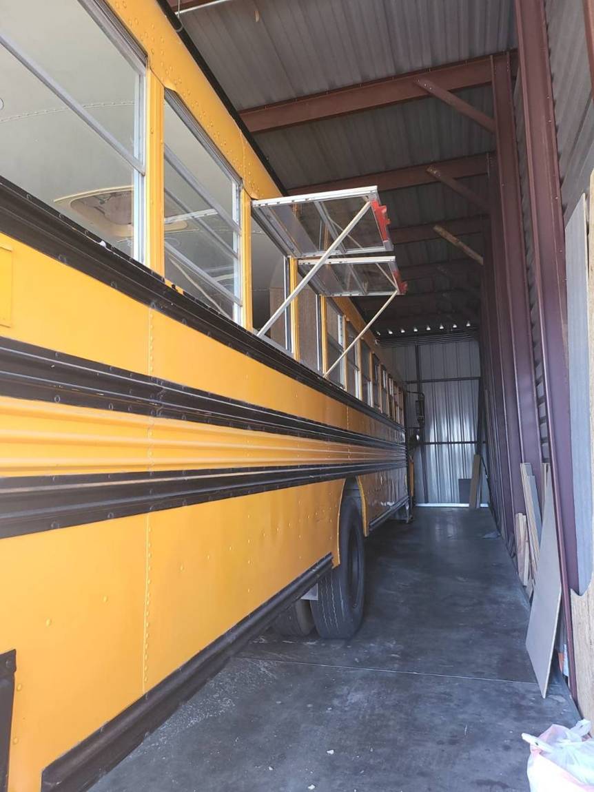 The bus in our shop with new serving windows propped open