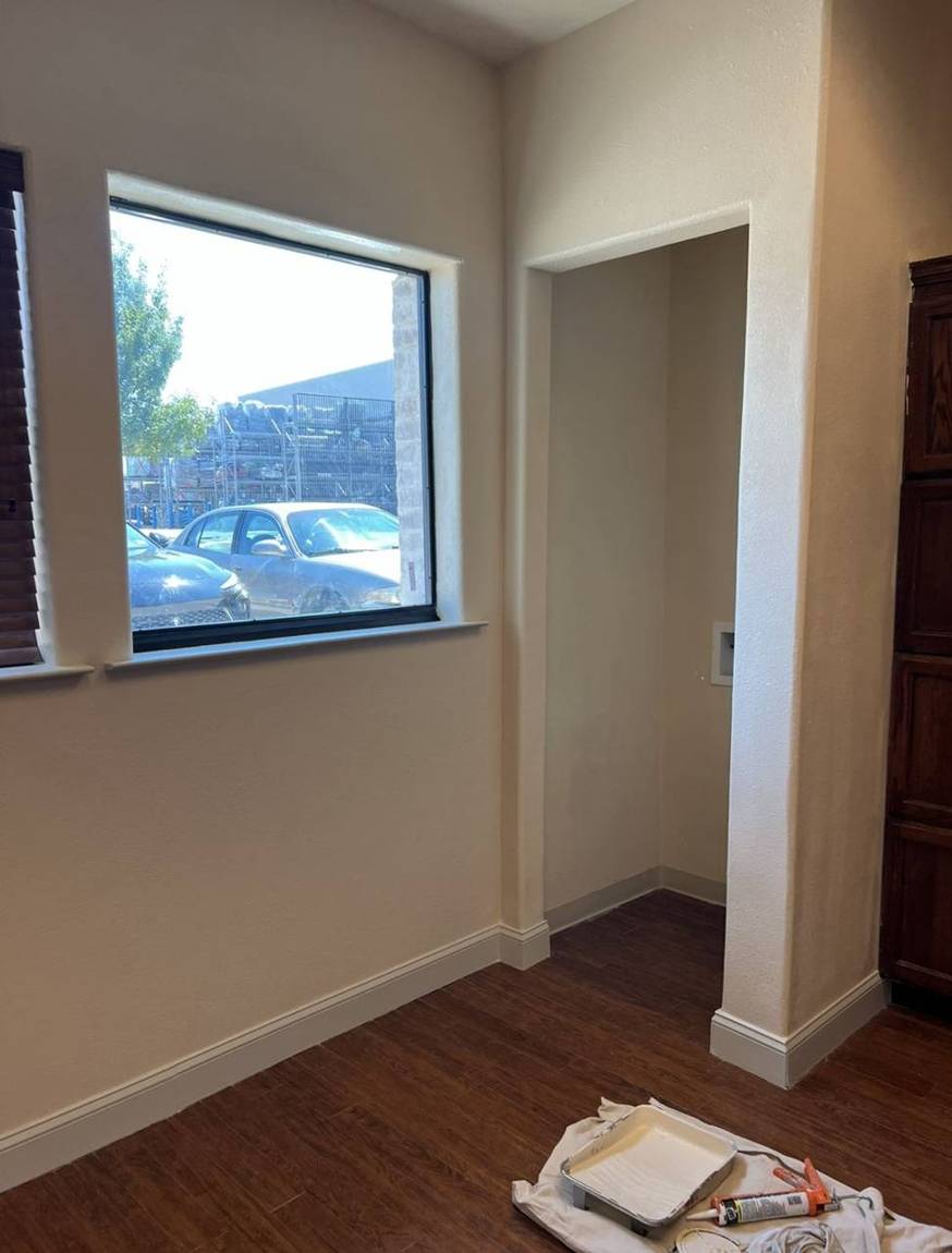 Repaired interior wall, window and laundry closet, freshly painted