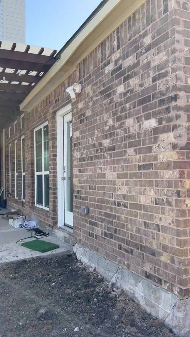 Finished brick wall with new exterior door