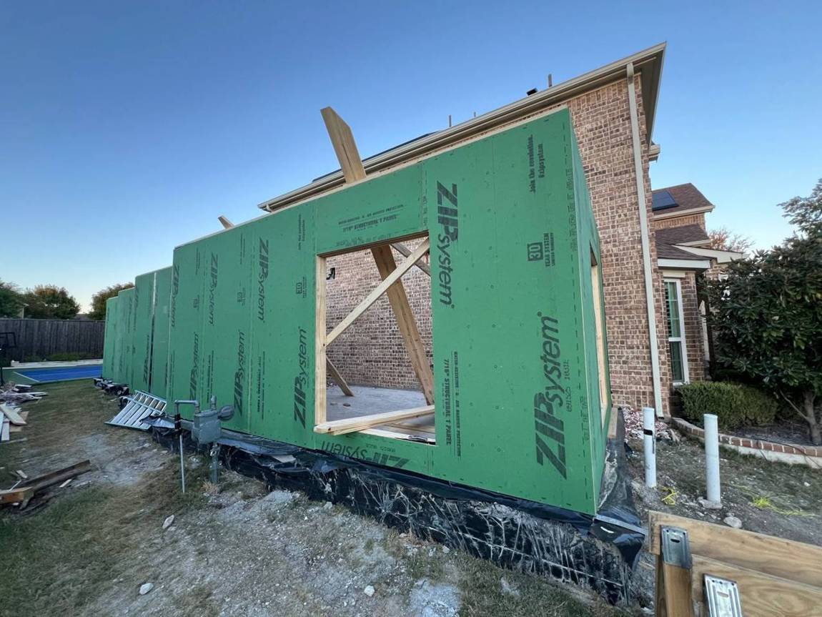 Walls framed and wrapped in green ZIP System sheathing