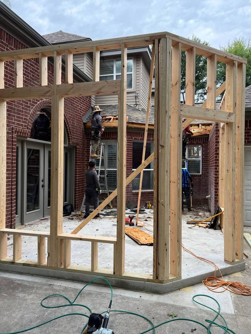 Wall framing going up on the new slab