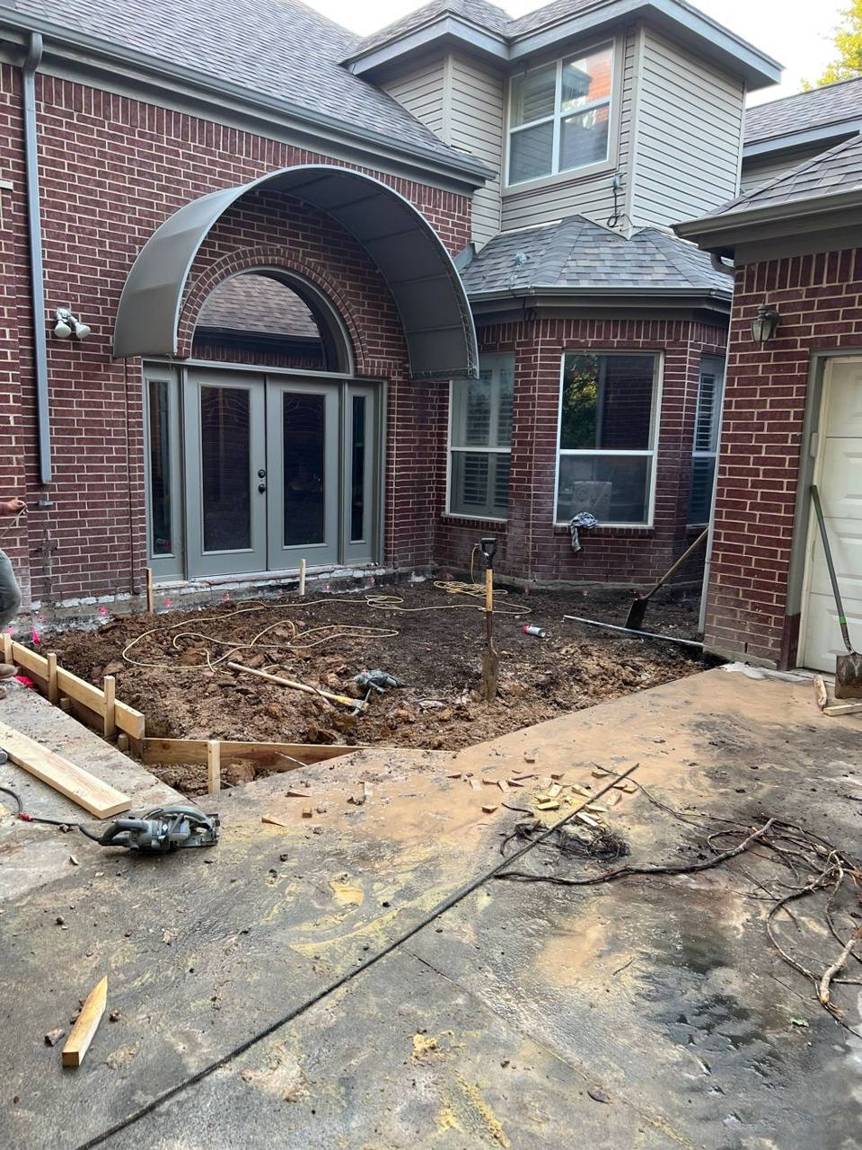 The open courtyard dug out and leveled before the addition