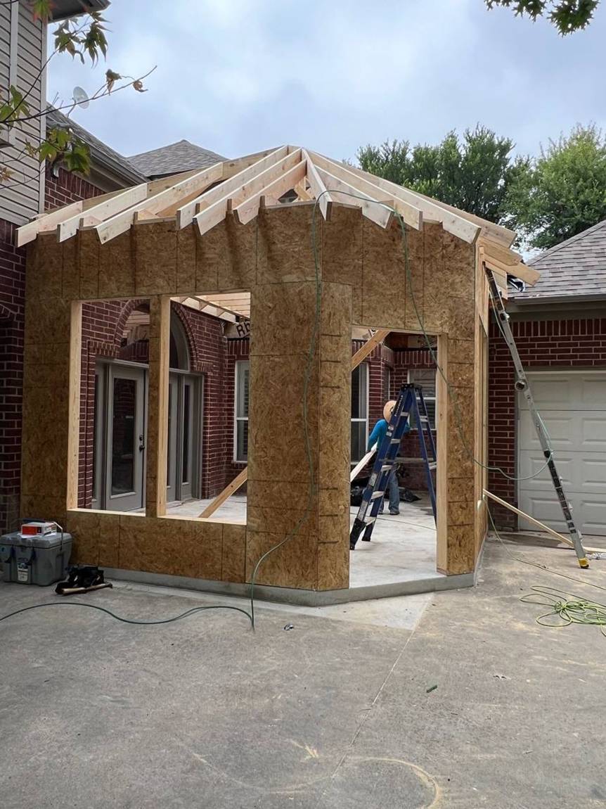 Walls sheathed and hip roof framed
