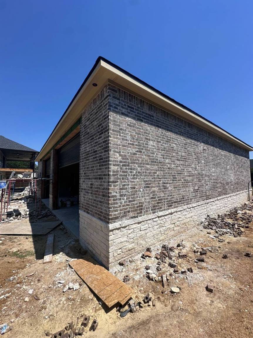 Finished brick corner with stone wainscot