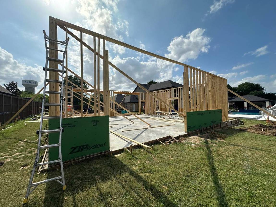Tall framed walls standing on the slab