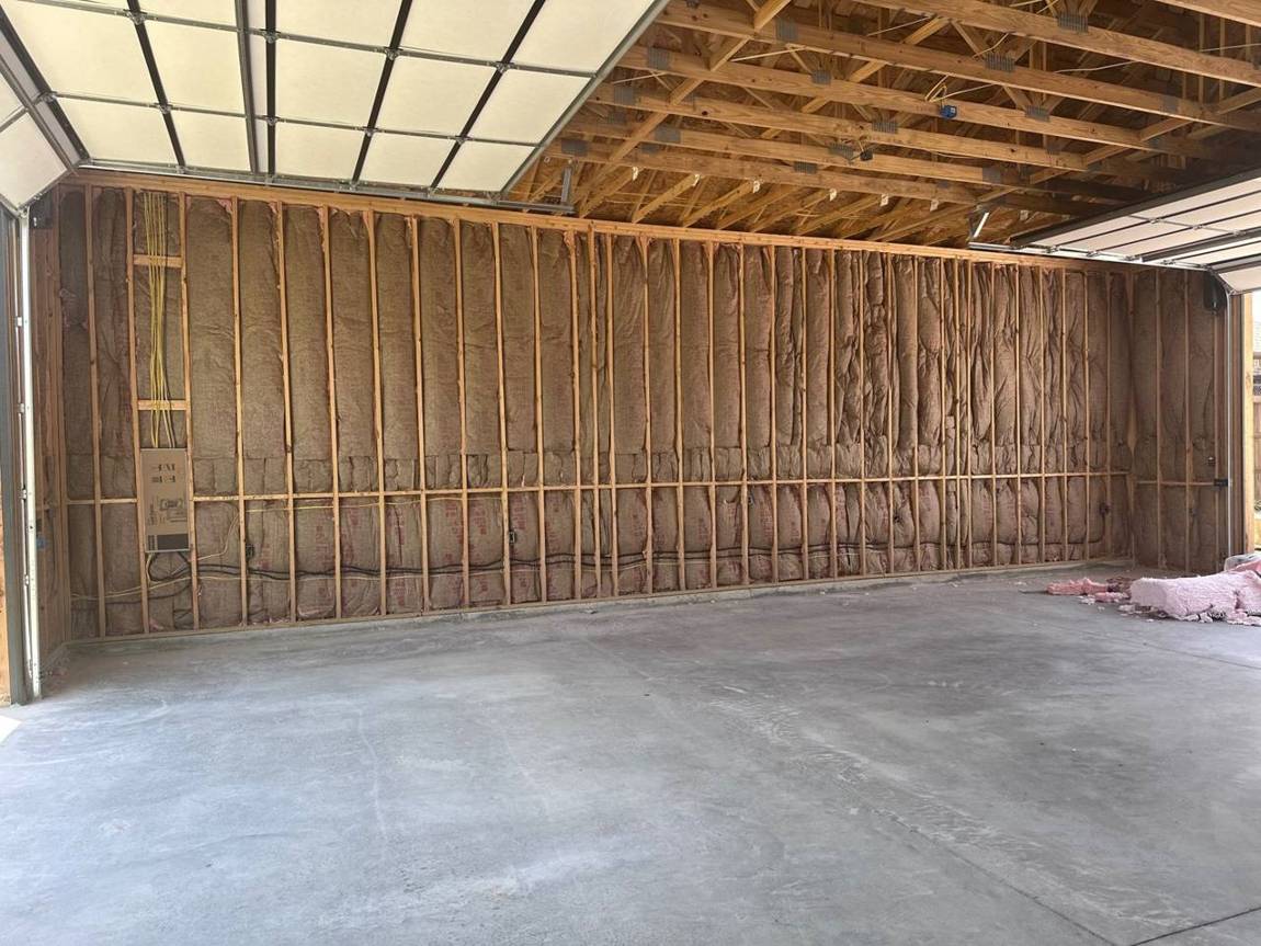 Interior walls wired and insulated under exposed trusses
